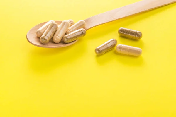 Herbal Medical Capsule Yellow Background Natural Vitamin Supplements Food — Stock Photo, Image