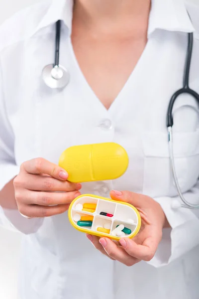 Woman Doctor Holding Yellow Pill Box Daily Medication Medicine Treatment — Stock Photo, Image