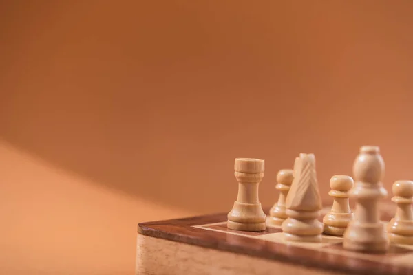 Wooden Chess Pieces Brown Background — Stock Photo, Image