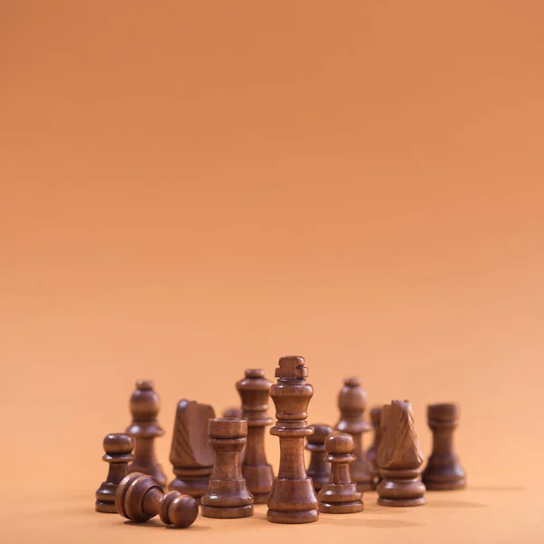 Group Chess Wooden Pieces Brown Background Format Square — Stock Photo, Image