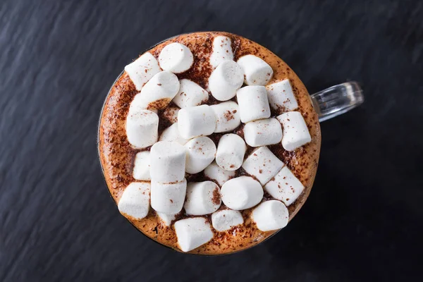 Delicious and sweet coffee cup with chocolate marshmallows. Top view.