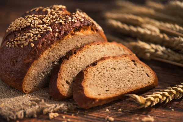 Tasty Rye Bread Sesame Wooden Background — Stock Photo, Image