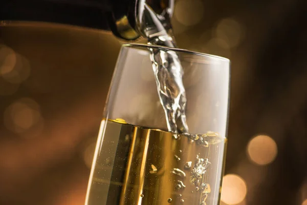 Sparkling White Champagne Poured Glass Golden Bokeh Circles Background Christmas — Stock Photo, Image