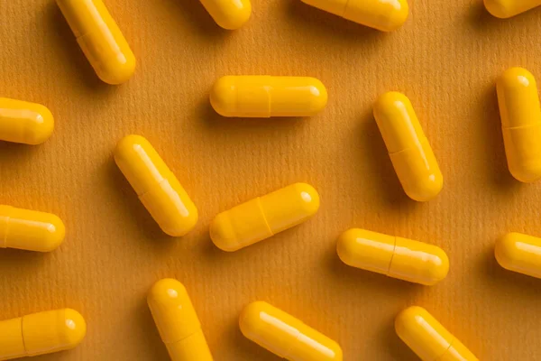 Żółte Tabletki Witaminowe Kapsułce Tle Widok Góry — Zdjęcie stockowe