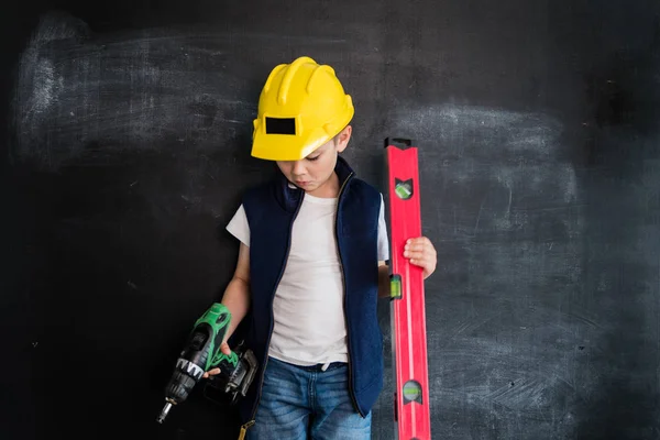 Young Boy Standing Screwdriver Helmet Blackboard Young Builder Creative Design — Stock Photo, Image