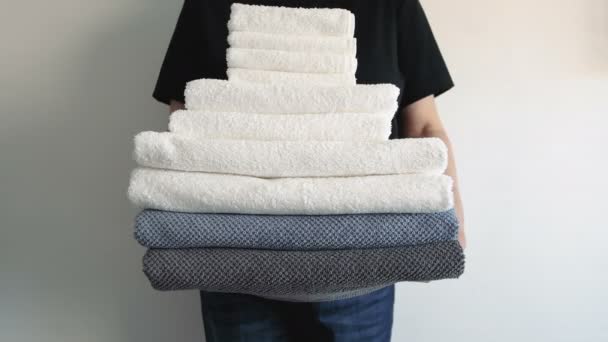 Woman Stack Different Towels Leaving Shot Put Place — Stock Video