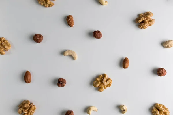 Nuts Walnuts Hazelnuts Almond Cashew Placed Pattern White Wooden Table — Stock Photo, Image