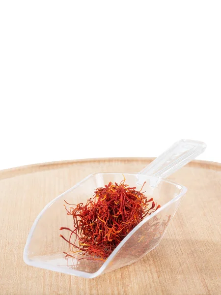 Saffron in a plastic scoop isolated on a white — Stock Photo, Image