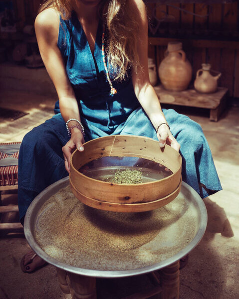 Woman Making Homemade Spices, Dry Zaatar. Traditional Lebanese Seasoning. Natural Antioxidant. 