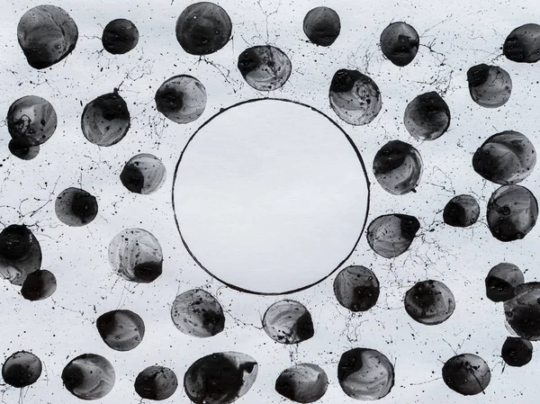 Black bubbles, circles and splashes. Black and white background. BW. Spray