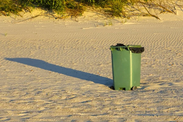 The waste container is placed on a sandy beach to keep it clean and to protect the environment. This is visible in Kolobrzeg , Poland