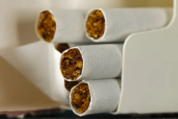 Cigarettes without filter are in an open package