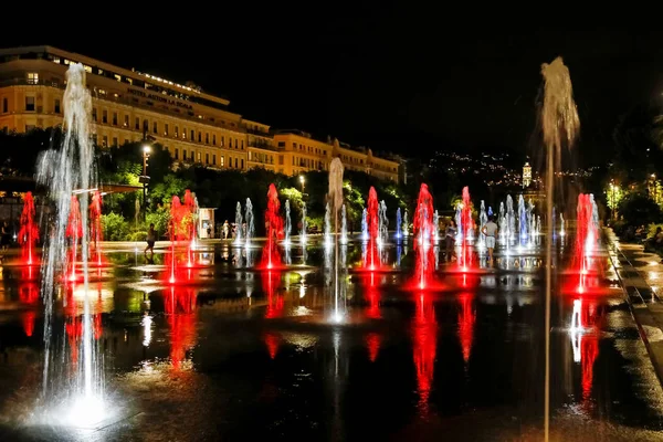 Illuminated strong jets of water — Stock Photo, Image