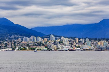 Vancouver North Shore skyline and waterfront with Grouse mountain in British Columbia Canada clipart