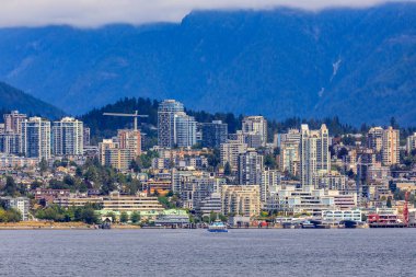 Vancouver North Shore skyline and waterfront with Grouse mountain in British Columbia Canada clipart