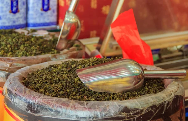 Bulk loose green tea for sale in bags at the market in Xiamen, China