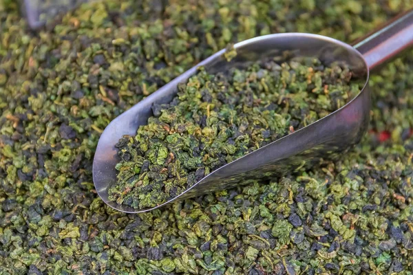 Bulk loose green tea for sale in bags at the market in Xiamen, China