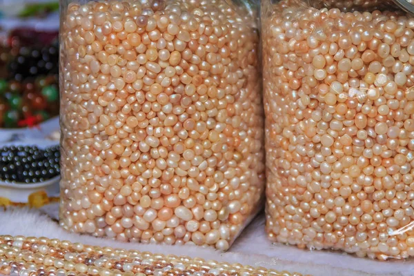 Bags and strings of pearls at the tourist market in Gulangyu Island in China
