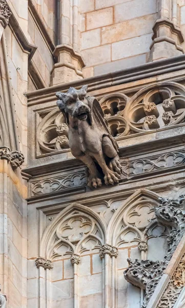 Ornate gothic gargoyles on the sculptures on the facade of Cathedral of the Holy Cross and Saint Eulalia, or Barcelona Cathedral at sunset in Barcelona, Spain