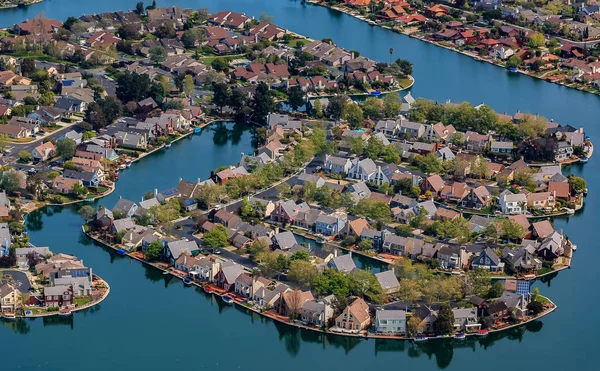 Aerial view of houses in Foster City section on Central Lake canals by the San Francisco Bay in San Mateo County, California