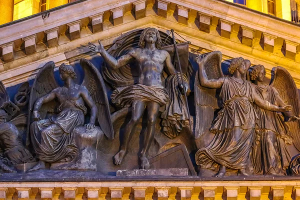 Close up of of the relief of Jesus with angels on the facade of Saint Isaac\'s Russian Orthodox Cathedral in Saint Petersburg, Russia at sunset