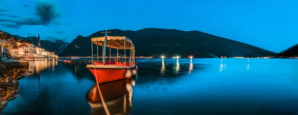 Kotor Bay, long exposure teal and orange sunset panorama and a docked boat in postcard perfect town of Perast Montenegro — Stock Photo, Image