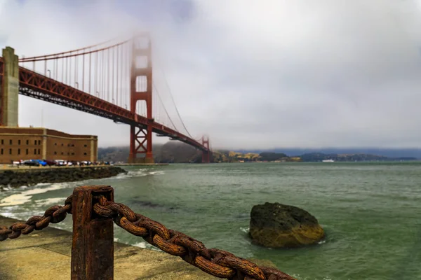 Golden Gate bridge with low fog rolling in San Francisco, California