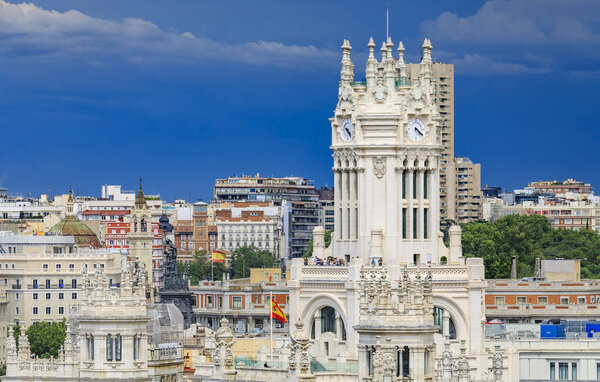 Madrid, Spain - June 4, 2017: Ornate gothic building of Cibeles Palace or Palacio de Comunicaciones on Plaza de Cibeles in Madrid, Spain, aerial view