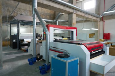 Laser cutting machine factory for textile transfer fashion industry clipart