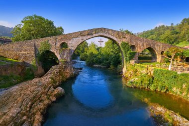 Cangas de Onis roman bridge on Sella river in Asturias of Spain clipart