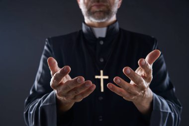 Priest open hands arms praying offering oblation clipart