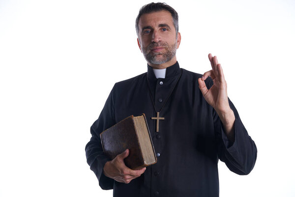Priest with ok finger hands sign isolated background