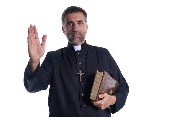 Priest male blessing hand with holy Bible in hand