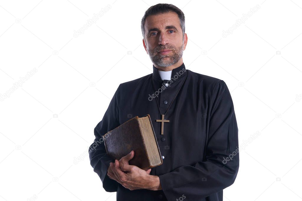 Priest portrait with Holy Bible in hands isolated on white