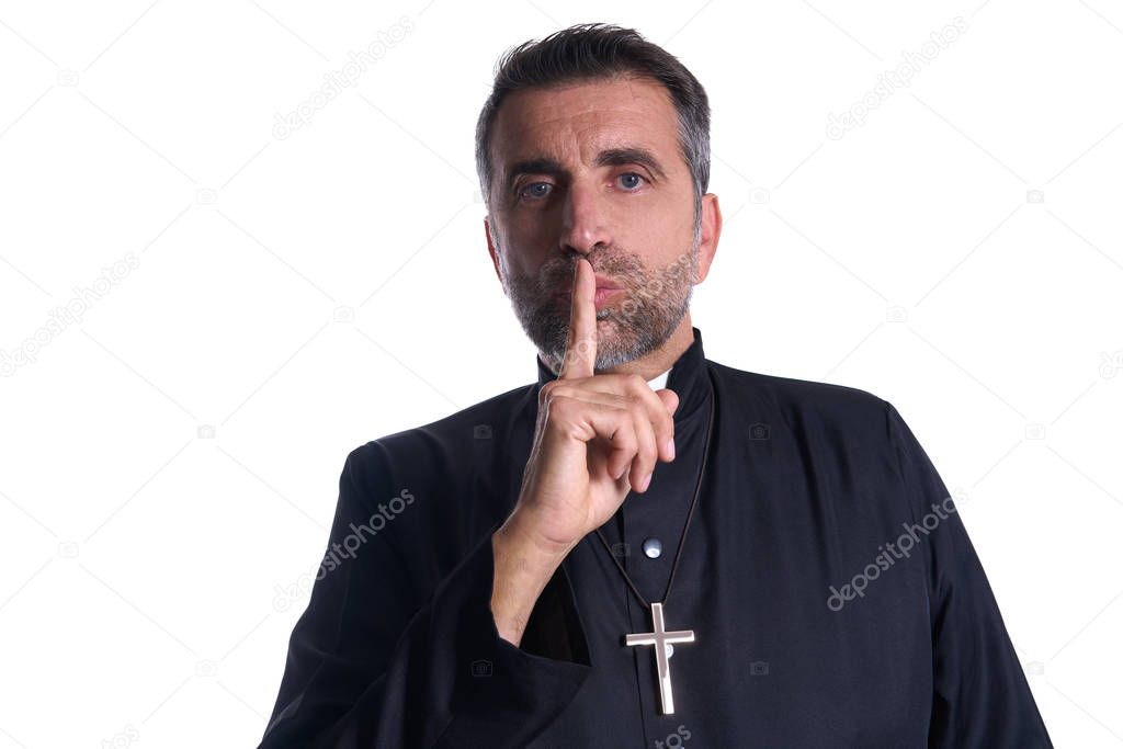 Priest with finger in lips as a silence expression request