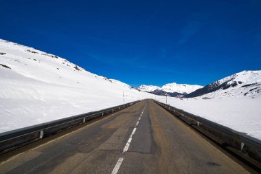 Baqueira Beret road in Lerida Catalonia ski  resort in Aran Valley of Pyrenees Spain clipart