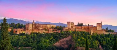 Alhambra fortress sunset in Granada of Spain at andalusian clipart