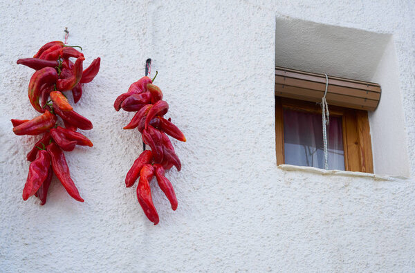 Red hot chili peppers hanging in Alpujarras of Granada facades to dry