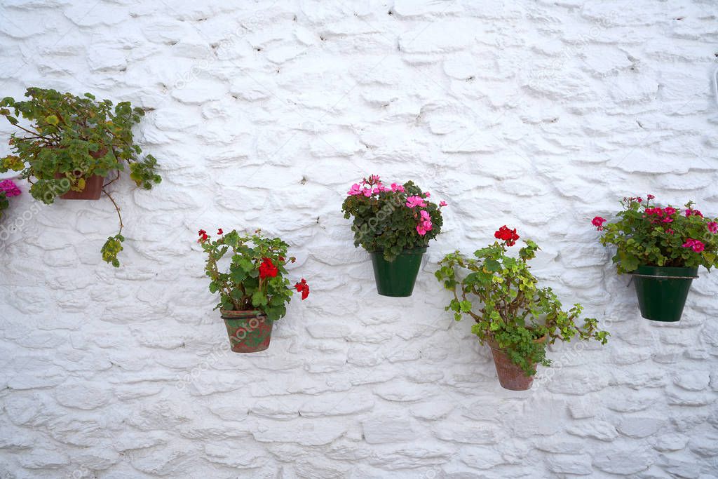 Alpujarras street flower pots in Granada at Pampaneira village of Andalusia Spain