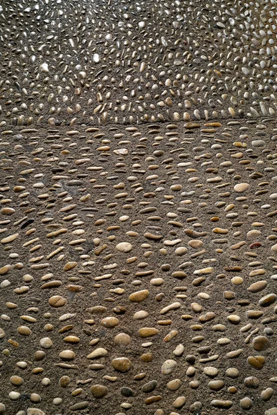 Altea soil rolling stone mosaic on flooring of Alicante Spain