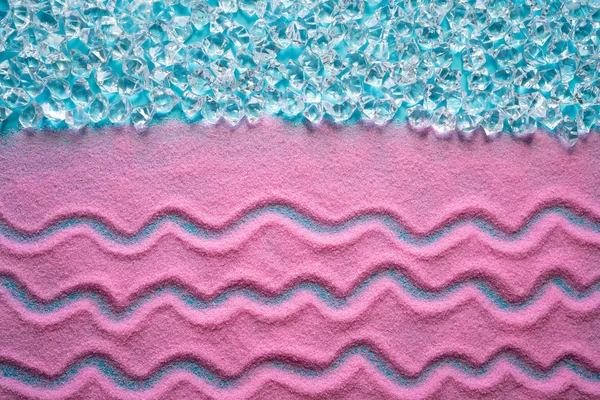 Pink beach sand background with aqua — Stock Photo, Image