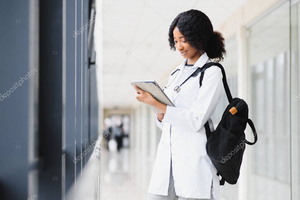 Medical Internship Concept. Portrait Of Young Black Female Doctor Student In White Coat.