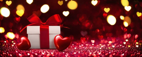 Gift with Hearts on Red Background — Stock Photo, Image