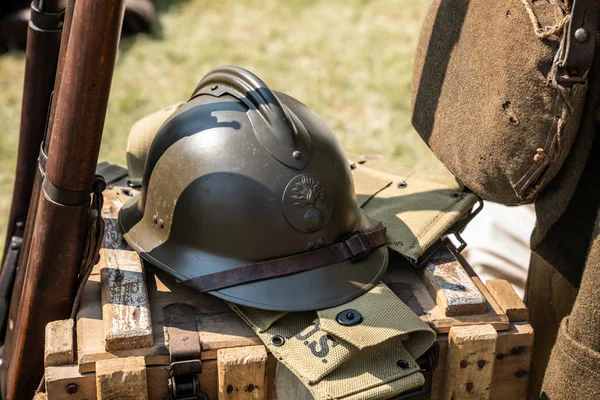 Green French military helmet with RF initials (French Republic) on the front