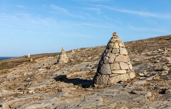 Cairn, piles of stones on the coast of Port Guibello in Saint-Pierre Quiberon (Morbihan, France)