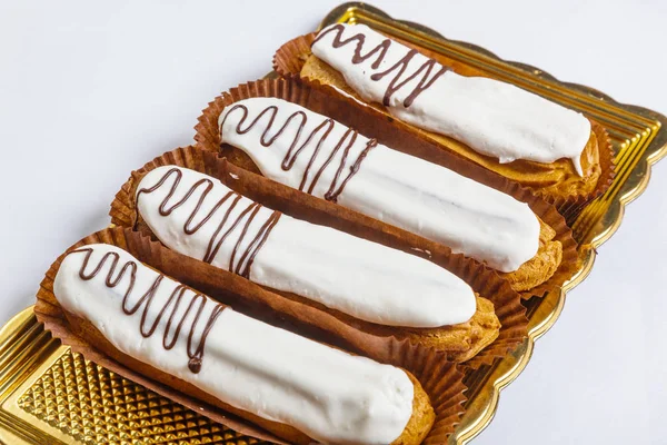 Eclair kage med fløde - Stock-foto