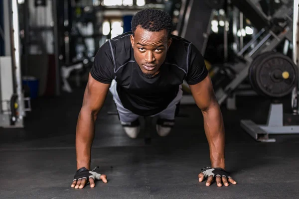 Black African American young man doing workout at the gym - Stock Image ...