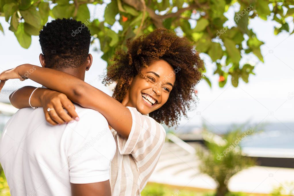 Outdoor protrait of black african american couple embracing each