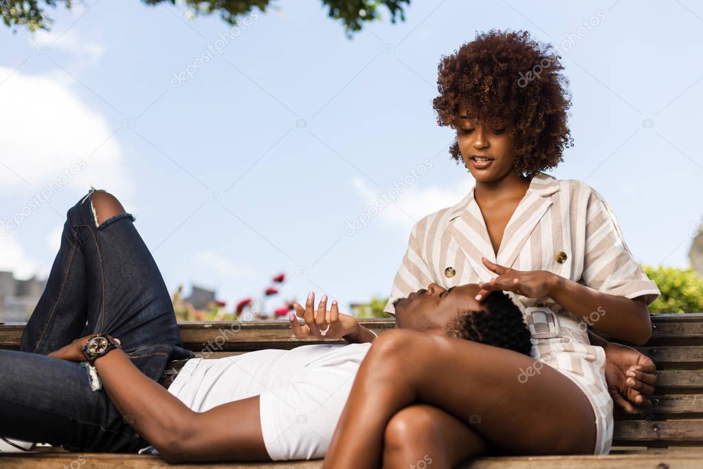 Outdoor protrait of black african american couple embracing each