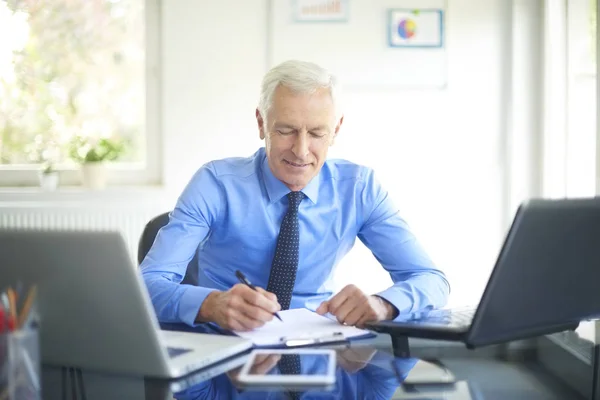 Smiling Senior Businessman Doing Some Paperwork Sitting Office Desk Working — Stock Photo, Image